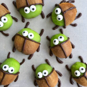 Beetlejuice Kiwis are decorated with chocolate and candy eyes to resemble cartoon beetles.