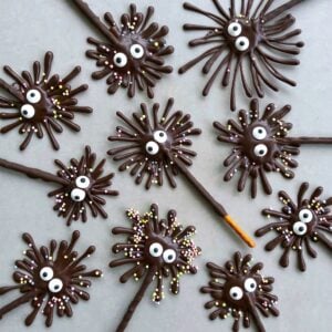 Chocolate pretzel firework treats with candy eyes and sprinkle decorations.