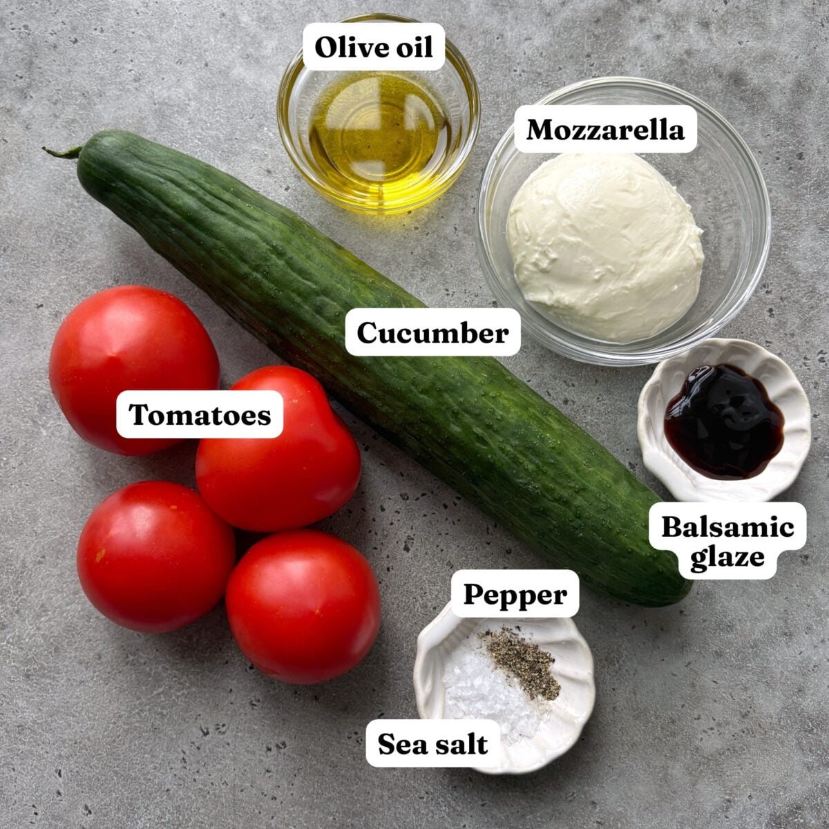A cucumber, tomatoes, olive oil, mozzarella, balsamic glaze, pepper, and sea salt.