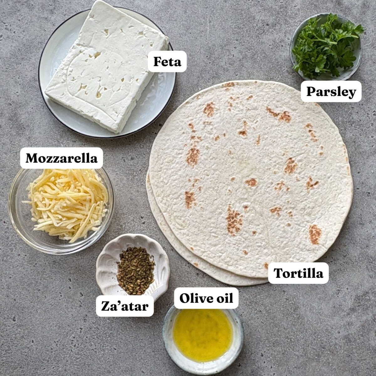 Ingredients including feta, mozzarella, and tortillas.