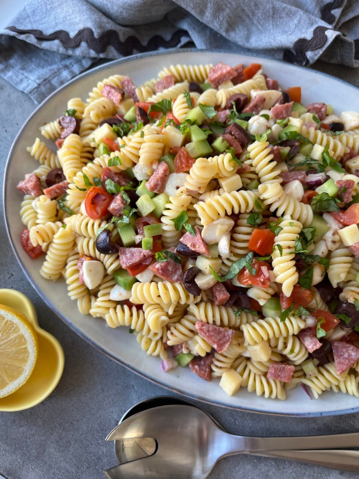 A side view of a platter of pasta salad.