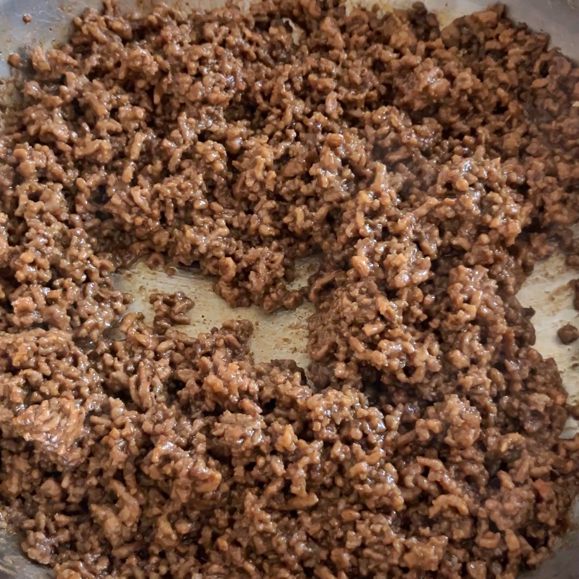 Mongolian Ground Beef cooked, seasoned, and browned perfectly in a skillet.
