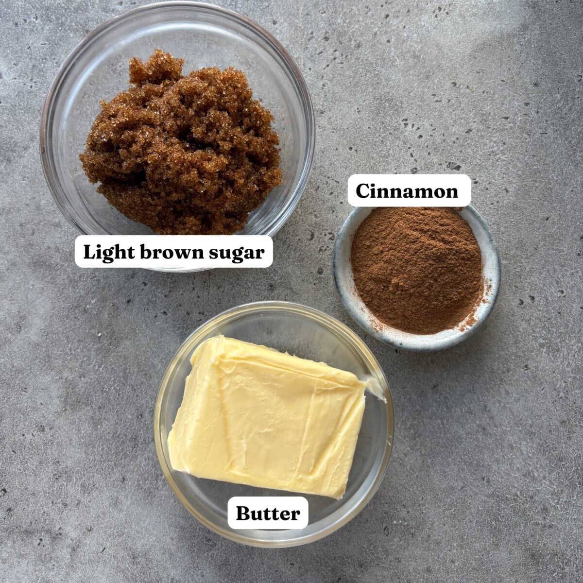 Ingredients for the filling including a bowl of cinnamon, light brown sugar, and butter.